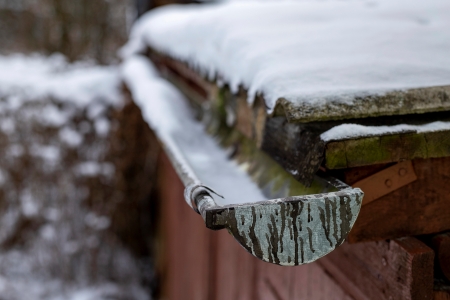 Close-up of asphalt shingles with winter algae streaks near Lake George